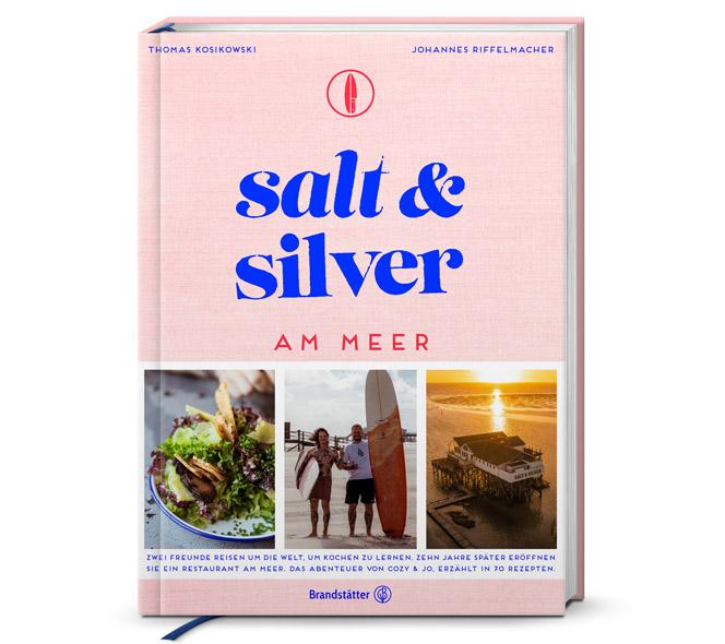 Rosa Kochbuch mit dem Titel »salt & silver am Meer« und drei Fotos drauf